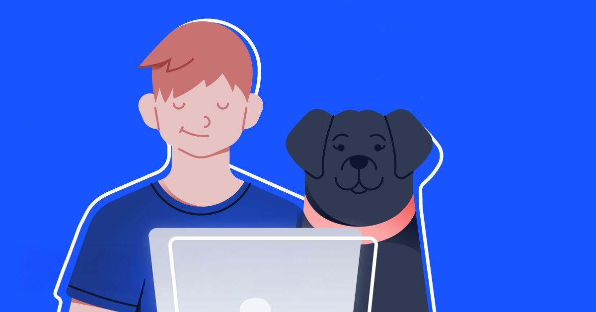 Mitchell Smith at a laptop with his dog